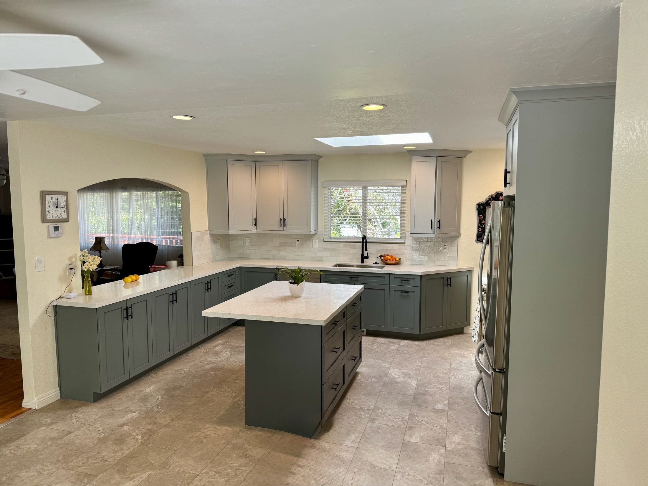Aromas kitchen remodel with gray two-tone cabinets and quartz island