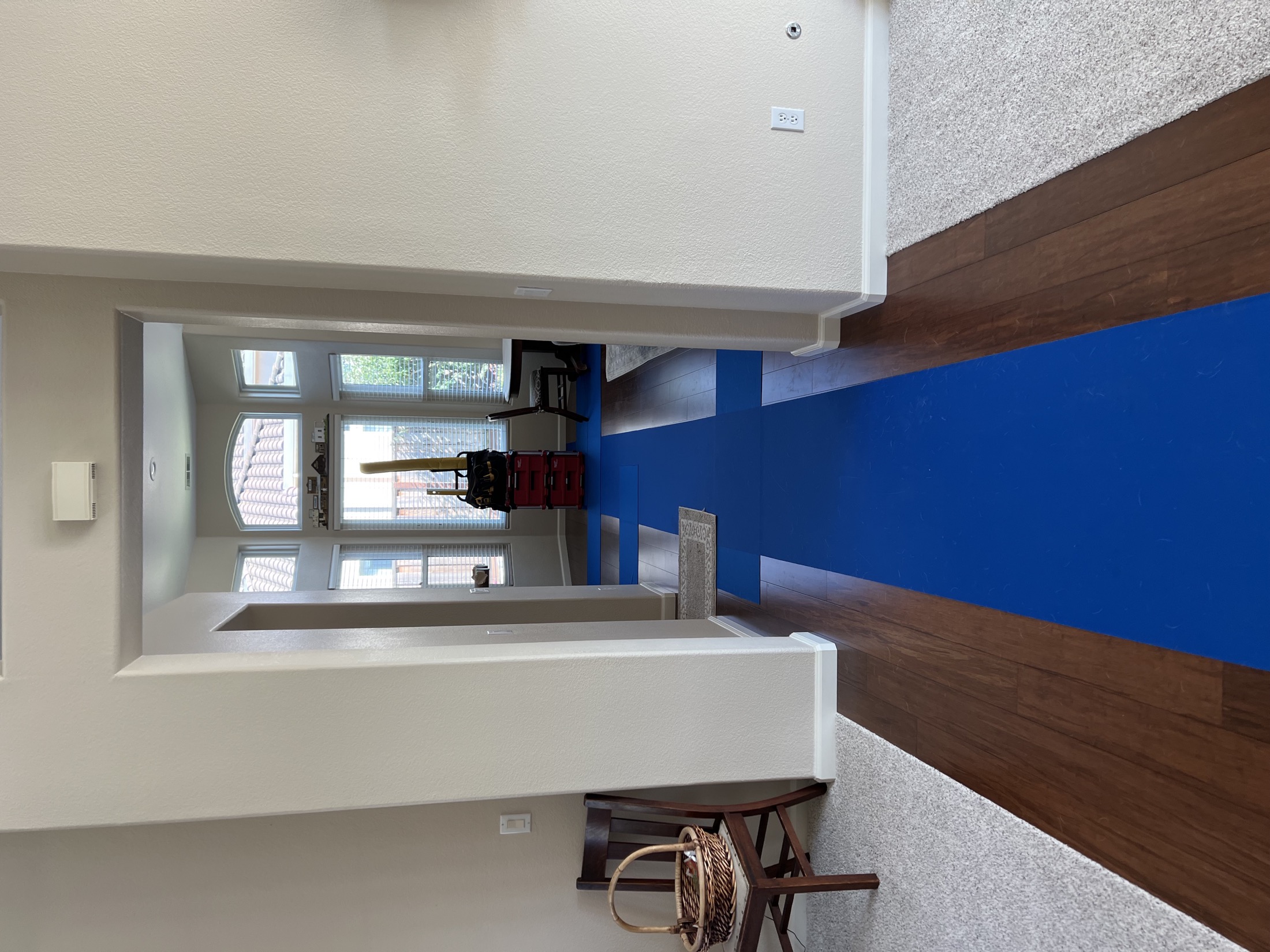 Floor protection runners installed in entry hallway during Hollister remodel