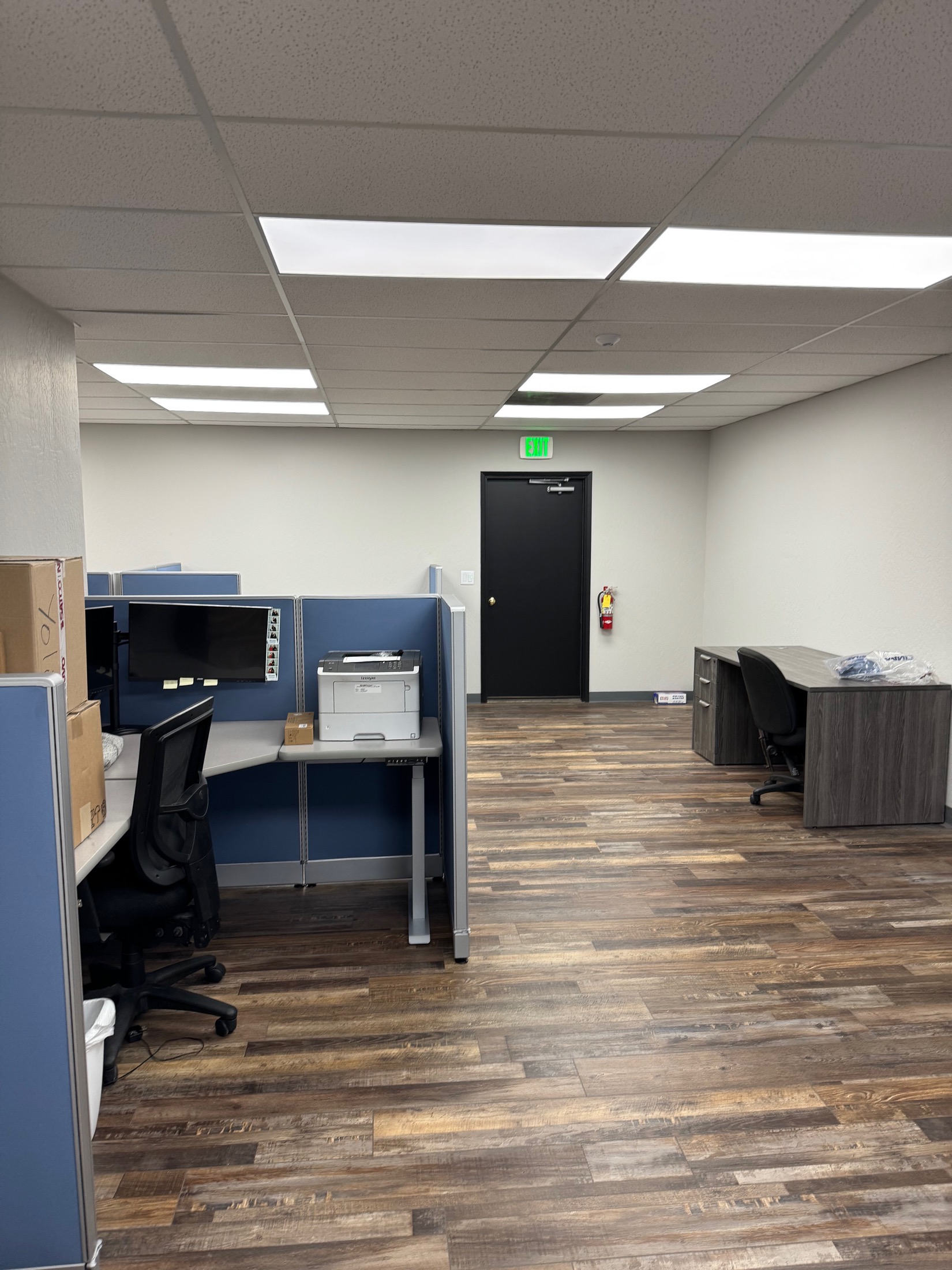 Gilroy commercial office wide view with cubicles and manager desk
