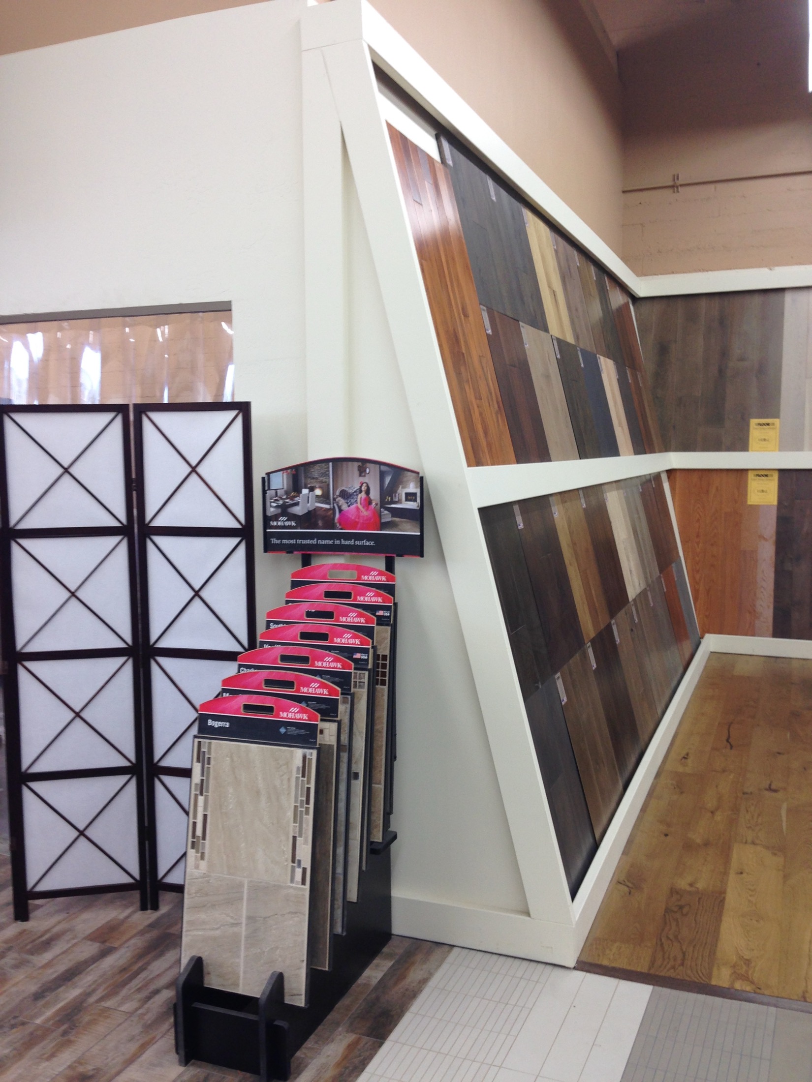 Hayward commercial flooring showroom with wood sample displays and tile stands