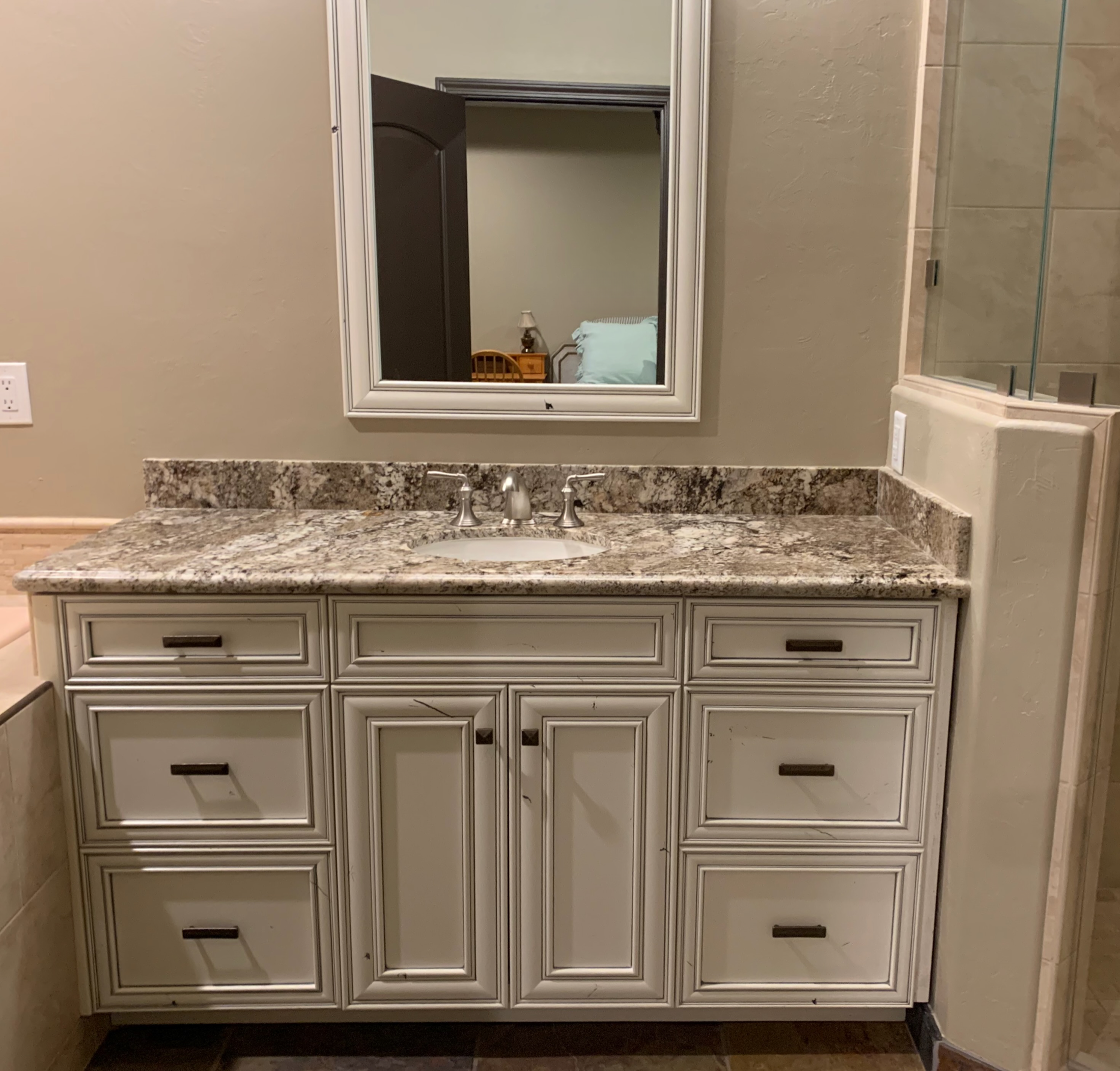 Hollister bathroom antique white vanity with patterned granite countertop