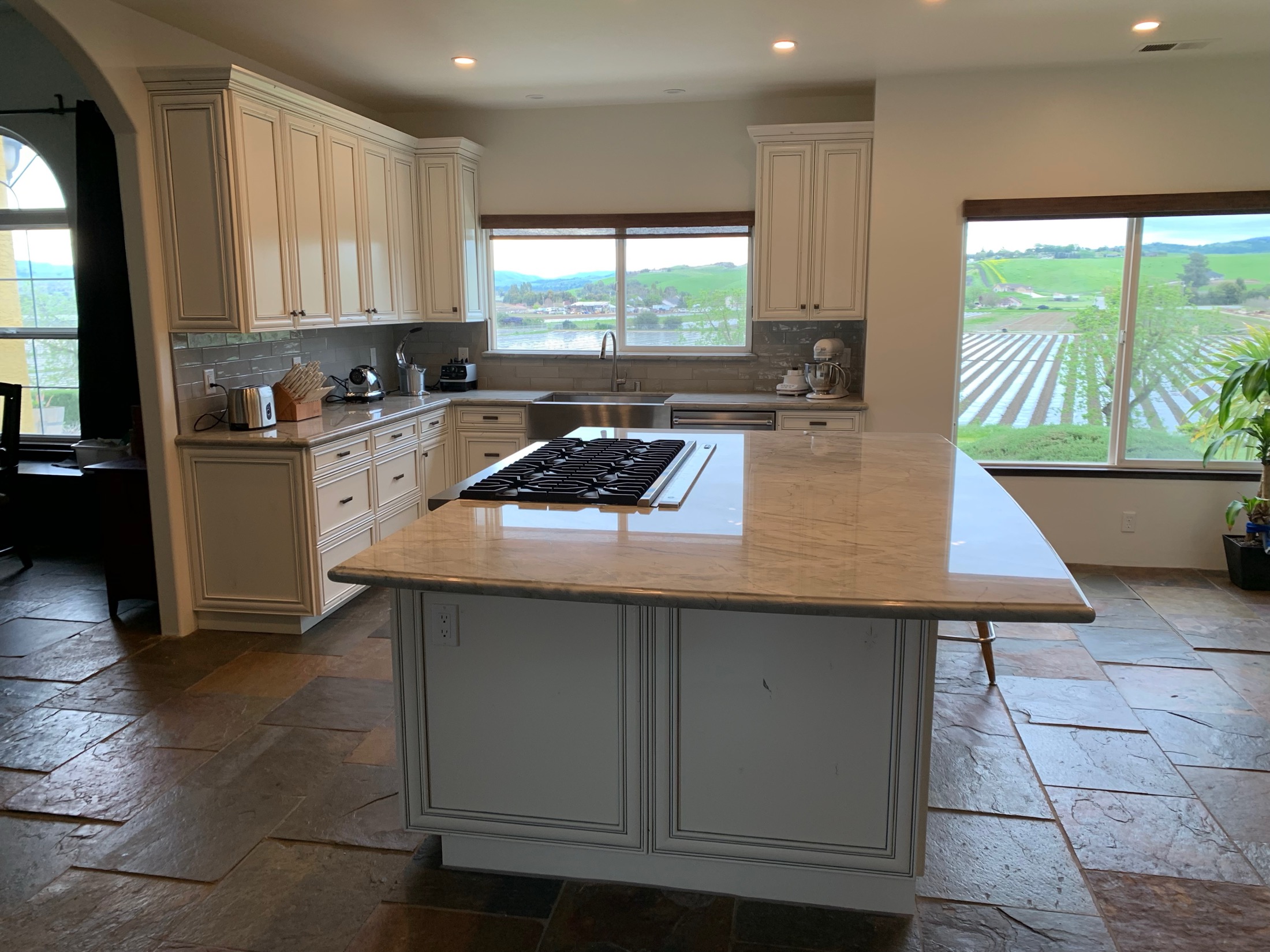 Hollister kitchen with antique white cabinets and valley view windows