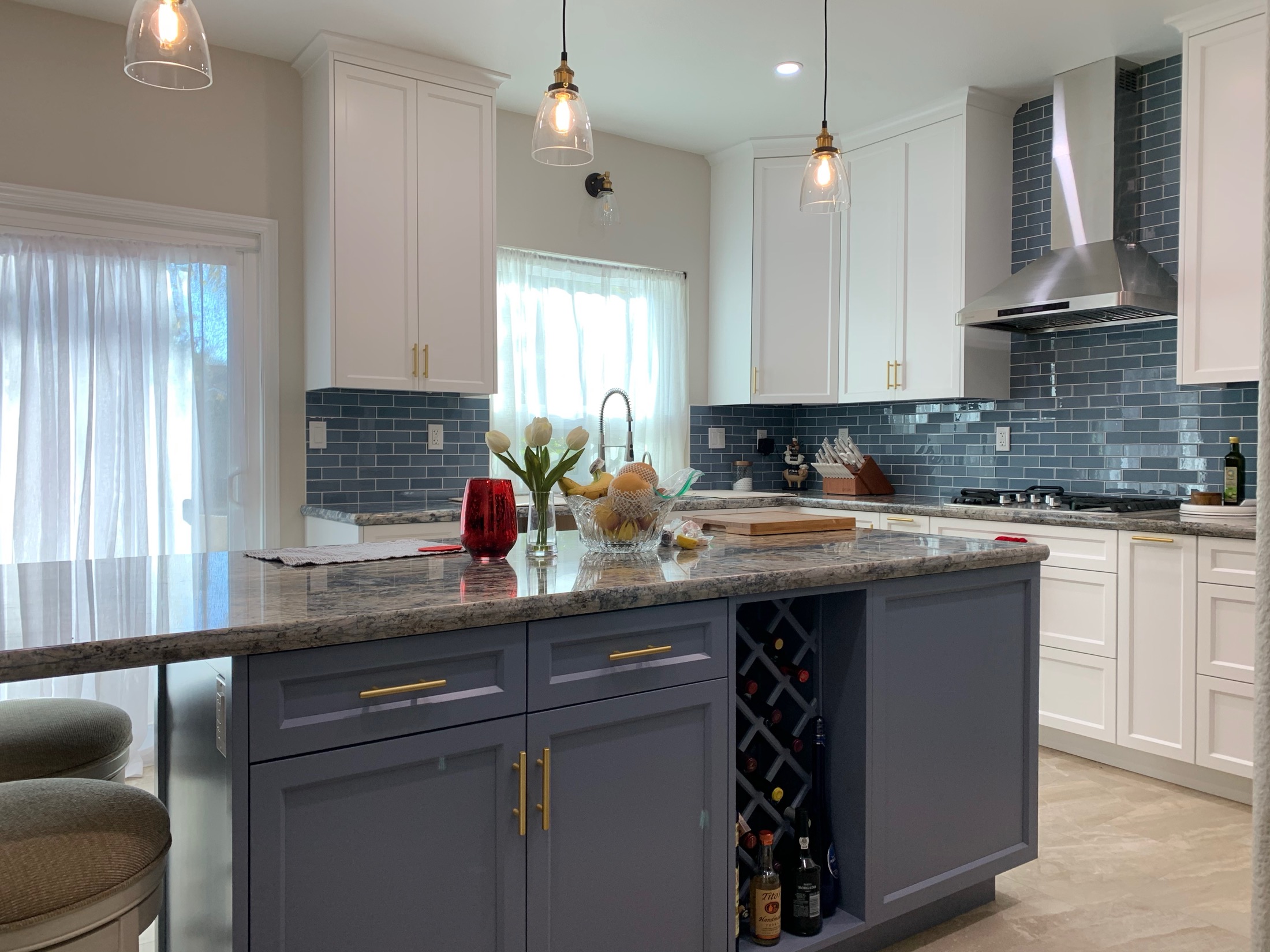 Hollister kitchen island with built-in wine rack and marble countertop