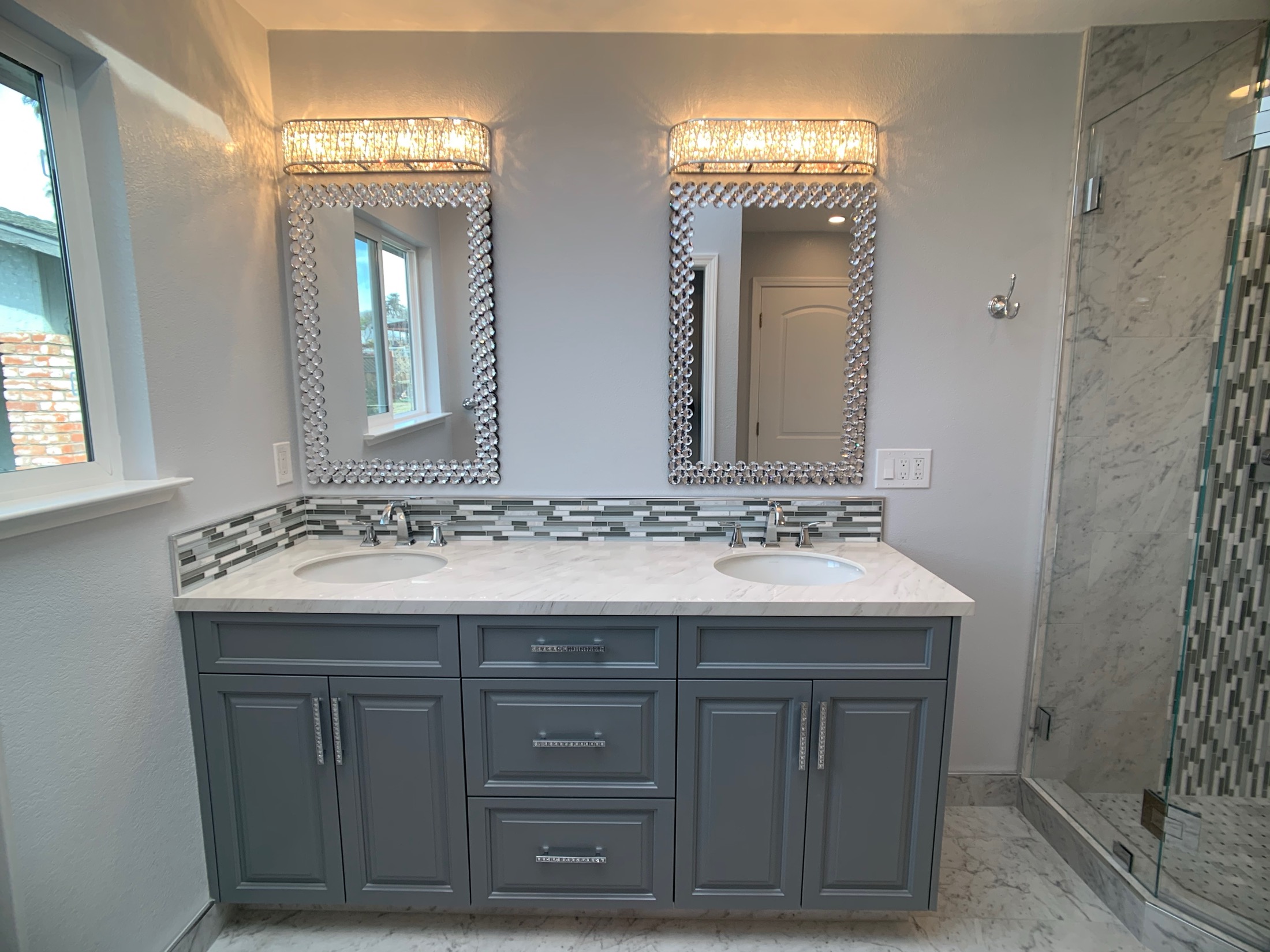 Hollister master bathroom dual vanity with crystal-bead mirrors and marble counter